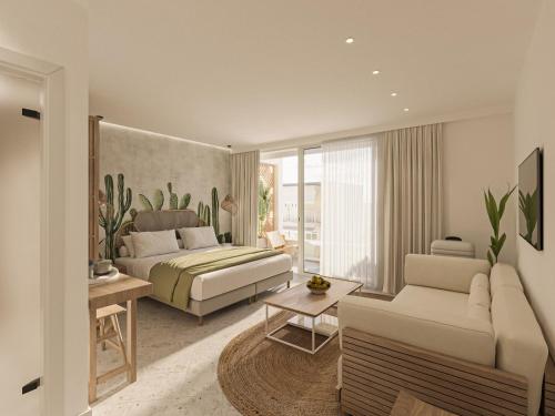 a bedroom with a bed and a living room with a couch at Sirines Luxury Hotel & SPA- Adults Only in Rethymno Town