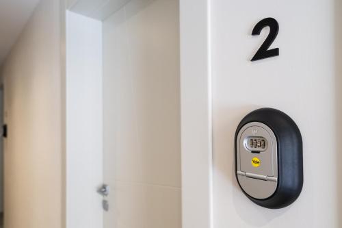 a door with a number on the wall at Hotel Dimorae Rooms and Suites - Apartments in Civitanova Marche