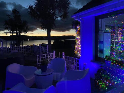 a christmas tree on the porch of a house at Seaview Cottage on the Island in Millbay
