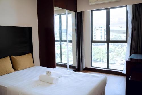 Postel nebo postele na pokoji v ubytování Suites SCSP Residence