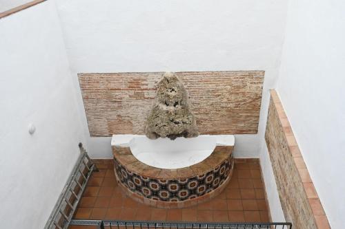 a bathroom with a toilet in a building at Homenfun Dalt Badalona in Badalona