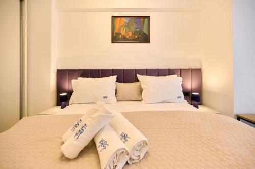 Giường trong phòng chung tại Niko Apartament Infinity