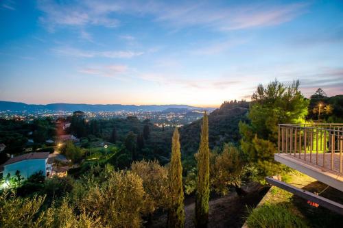 a view of a city from a balcony of a house at La Belle Villa - Family Retreat Magnificent View in Akrotiri