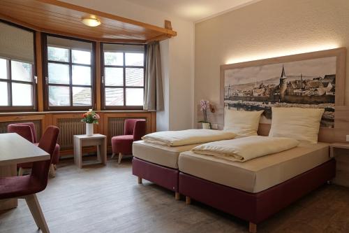 Giường trong phòng chung tại Hotel Alte Brauerei