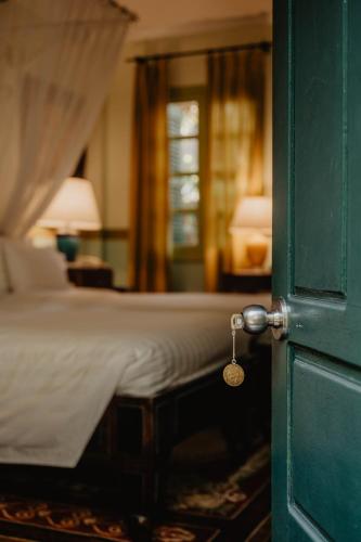 Ένα ή περισσότερα κρεβάτια σε δωμάτιο στο Villa Maly Boutique Hotel