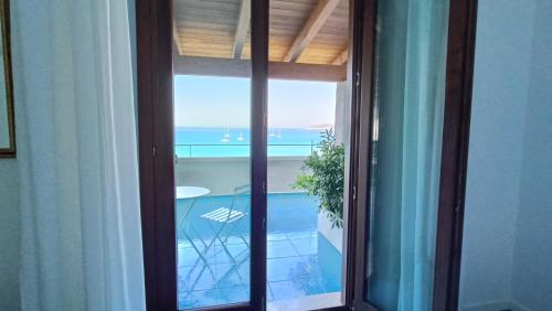 a view of the ocean from a room at Villa Tre Mari in Villasimius