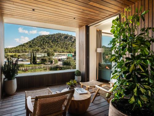 a balcony with a view of a mountain at Kimpton Aysla Mallorca by IHG in Santa Ponsa