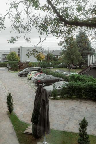 a patio with an umbrella in a parking lot at NED Hotel in Graz