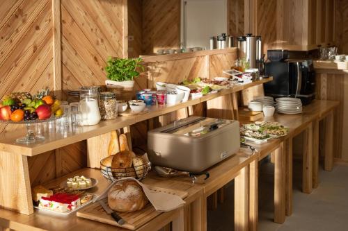 a kitchen with a table with food on it at Villa Tatrica in Kościelisko