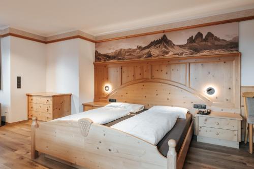 Postel nebo postele na pokoji v ubytování Hotel Tannenhof