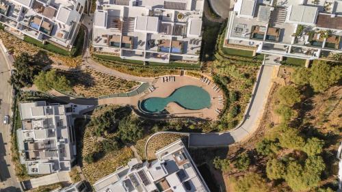 an aerial view of a park in a city at Casa Sol Luxury Rooftop Penthouse Gym Spa Pools in Marbella