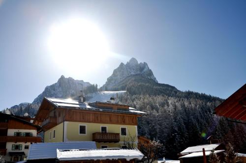 a view of a mountain with snow on the ground at Hotel Meida in Pozza di Fassa