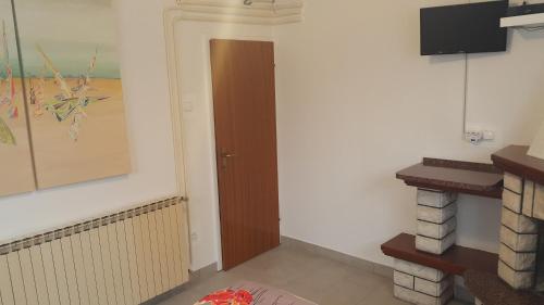 a hallway with a door in a room at Love 2 Solkan in Nova Gorica
