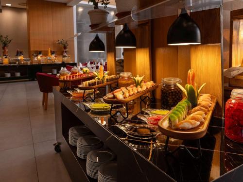 a buffet line with many different types of food at Novotel Jazan in Jazan
