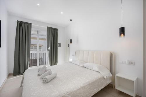 Ένα ή περισσότερα κρεβάτια σε δωμάτιο στο Atico castelar by Staycare