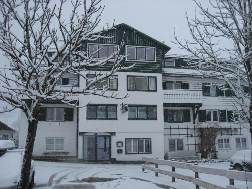 a large white building with snow on it at De Jutter Edelweiss in Gosau