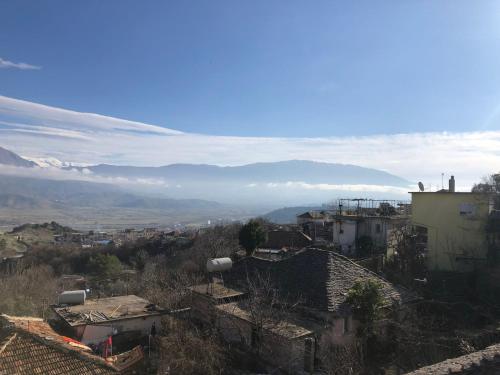 a view of a city with mountains in the background at Geni Guest House in Gjirokastër