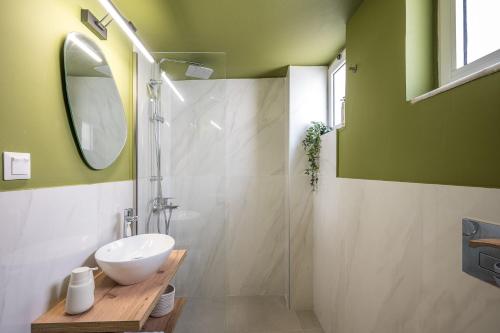a bathroom with a sink and a shower at Senaon Urban Living City Center in Heraklio Town