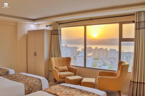 a hotel room with a view of the city at Jordan Seasons Hotel in Aqaba