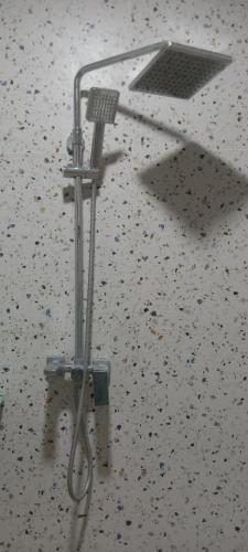a microphone on top of a floor with a table at Rezka Roomz Syari'ah in Ende