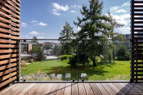 a balcony with a view of a yard at Hotel Shuum Boutique - Destigo Hotels in Kołobrzeg