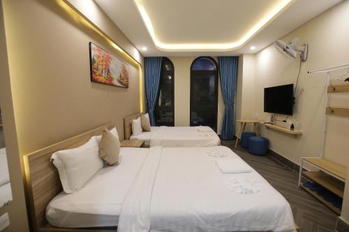 Кровать или кровати в номере Teddy 108 Homestay & Cafe - 3 stars - Grand World Phu Quoc