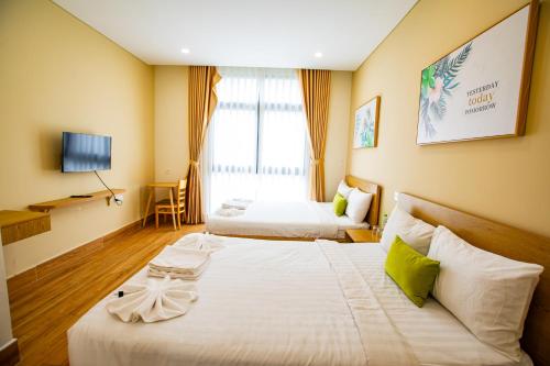 Кровать или кровати в номере Teddy 108 Homestay & Cafe - 3 stars - Grand World Phu Quoc