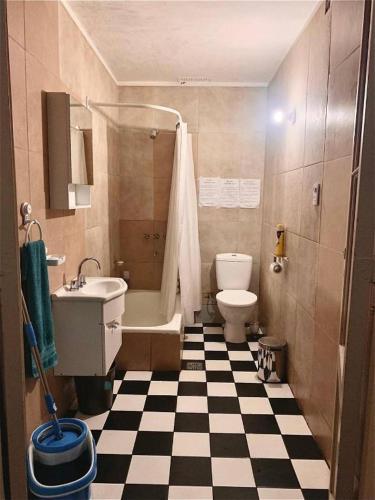 a bathroom with a black and white checkered floor at Beautiful stay in Abasto-Recoleta-O-P in Buenos Aires