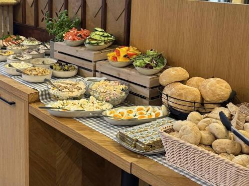 a buffet with many different types of food on a table at XYZ eXtreme You Zen in Szczyrk