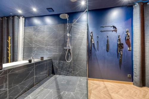 a bathroom with a shower with a glass door at Love Room L'Aixtase - Oasis Romantique à Aix-les-Bains in Aix-les-Bains