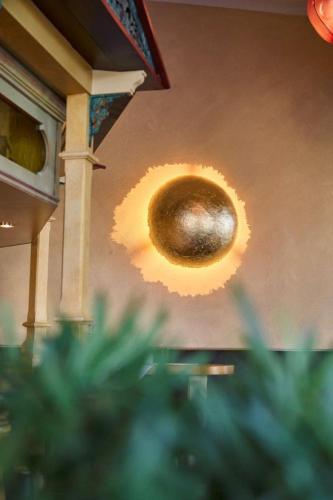 a orb hanging from the ceiling of a room at Strandhotel Luise von Preussen in Zinnowitz