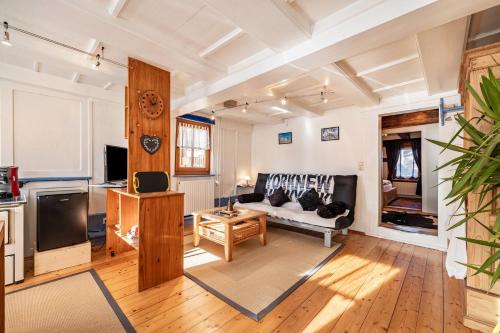 a living room with a couch and a table at Schuler-Haus in Balingen