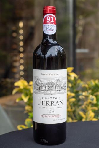 a bottle of red wine sitting on a table at Paj Hotelul Retreat & Spa in Sinaia