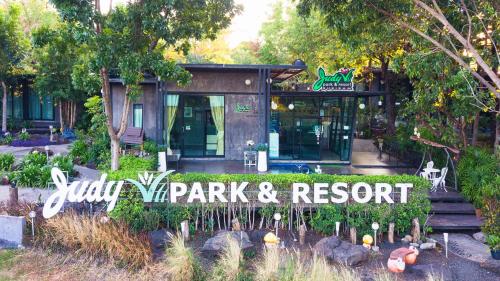 a park and resort sign in front of a building at Judy Park & Resort Buriram in Ban Nong Hua Wua