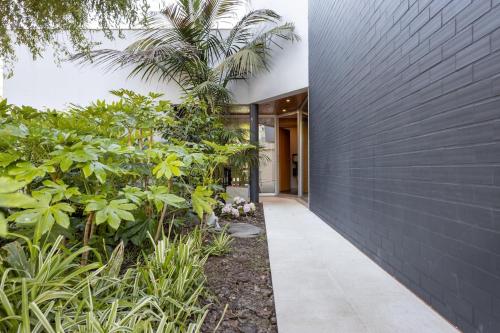 a hallway of a house with plants at Portugal Active Hábito's Lodge in Viana do Castelo