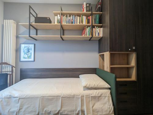Tranquillità nel Verde Casa con Giardino per 6 Personeにあるベッド