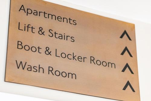 a sign that saysartments lift and stairs boot and locker room at Rock Mill 1 Bed Apartment 13 in Stoney Middleton