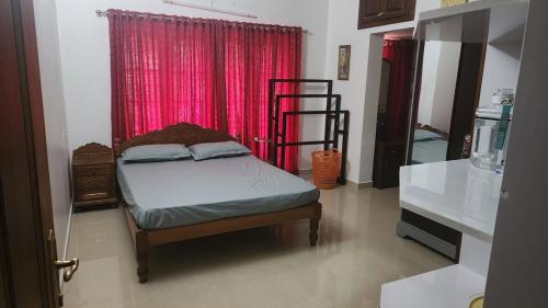Postel nebo postele na pokoji v ubytování Shebin's Home Stay Thiruvalla