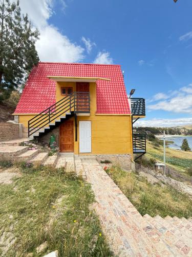 a small yellow house with a red roof at Chalet-Familiar Tota, full-equipado! CLIMATIZADO! in Tota