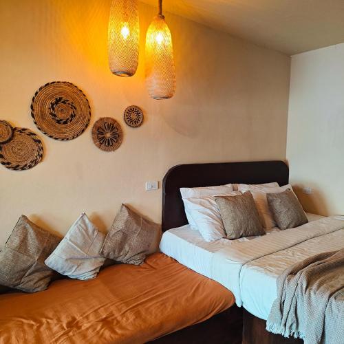 Ένα ή περισσότερα κρεβάτια σε δωμάτιο στο Bamboo Beachfront Koh Larn