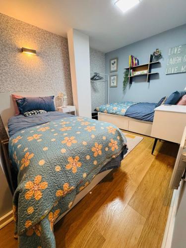 a bedroom with two beds in a room at #12 Stylish Canalside Loft with Parking in Coventry