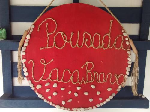a red sign with the wordulumoked fluoro at Pousada Vaca Brava in Areia