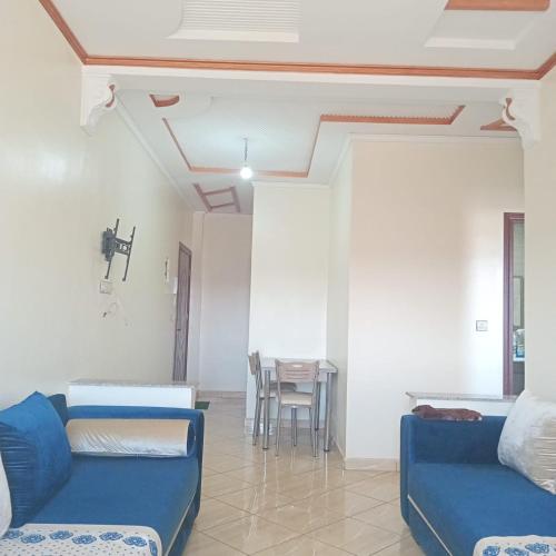 a living room with a couch and a table at Dar lara in Larache