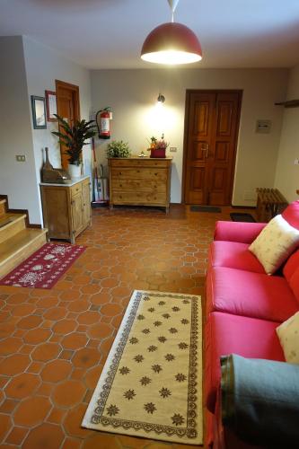 a living room with a couch and a rug at La Dimora della Fontana in Mozzio