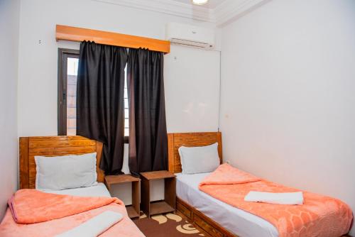 Cama o camas de una habitación en Appartement Afgo Ouarzazate