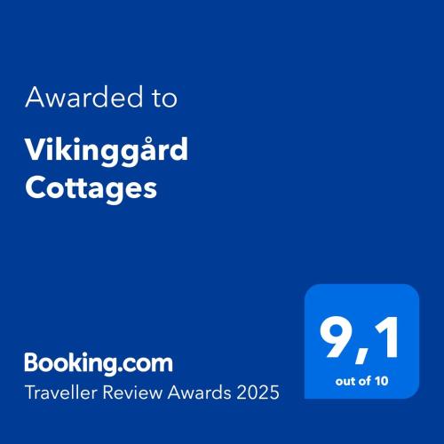 a blue sign with the text awarded to vikengard coffees at Vikinggård Cottages in Höljes