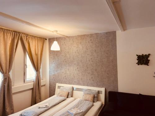 Ένα ή περισσότερα κρεβάτια σε δωμάτιο στο Veni Apartments