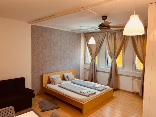 Postel nebo postele na pokoji v ubytování Veni Apartments