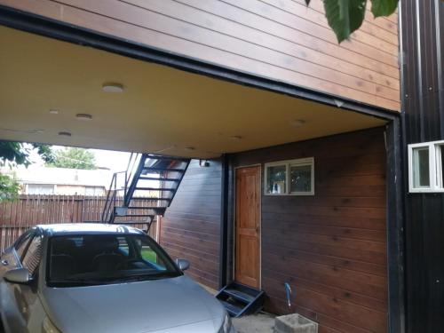 a car parked outside of a house with a garage at Rincón Puyehue Primer Nivel in Puyehue