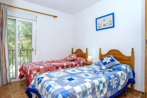 Ένα ή περισσότερα κρεβάτια σε δωμάτιο στο Agua Amarga 2